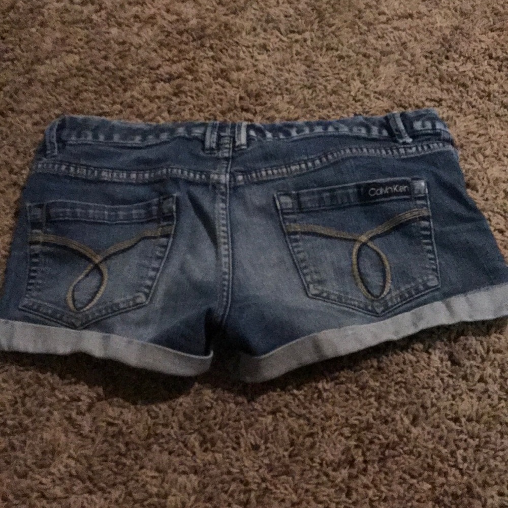 Calvin Klein distressed jean shorts